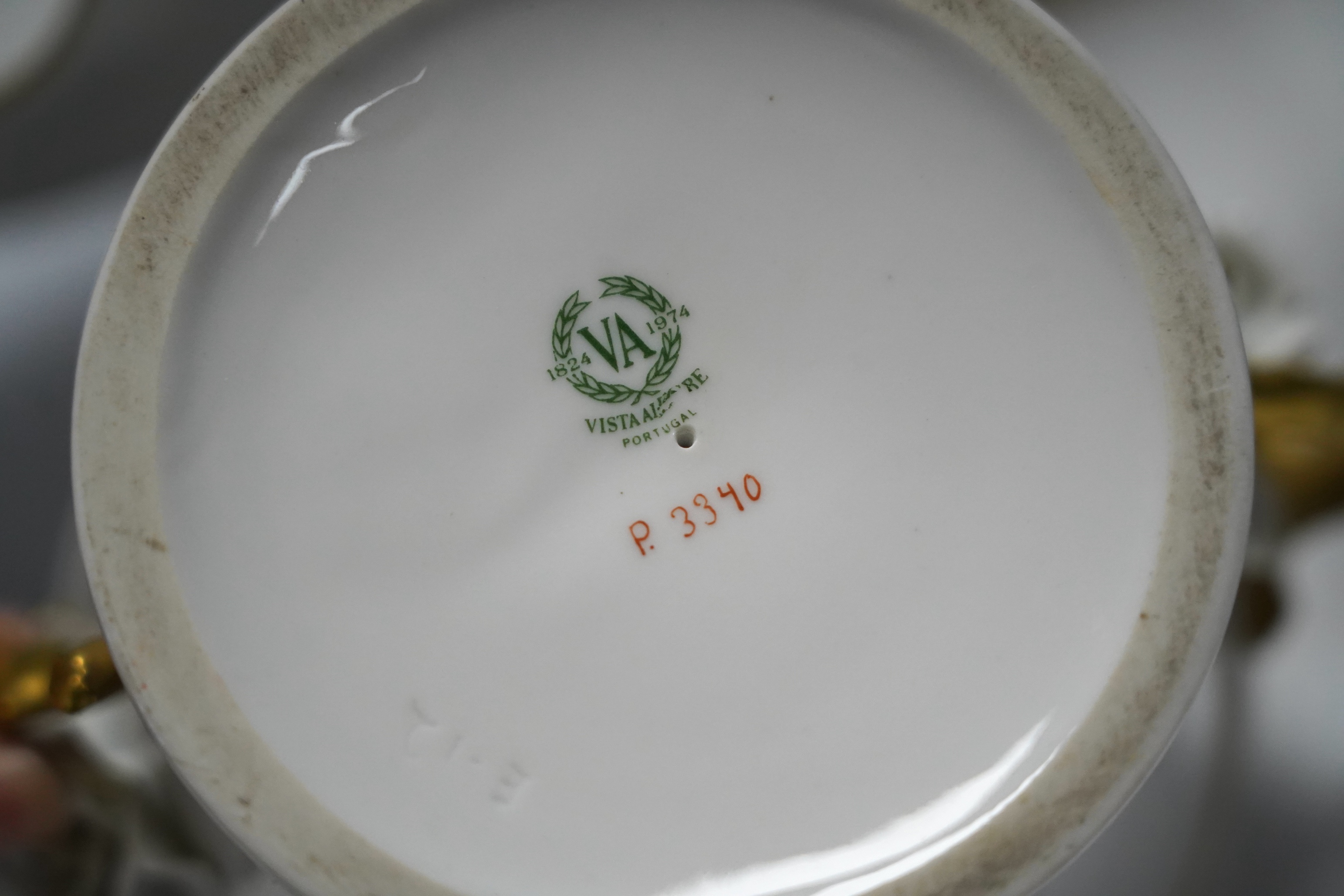 A group of Vista Allegre and other white and gilt porcelain urns, baskets etc, tallest 29.5cm